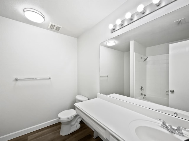 110 Nighthawk Dr, Krum, TX 76249 - full bathroom with toilet, wood finished floors, baseboards, tub / shower combination, and vanity