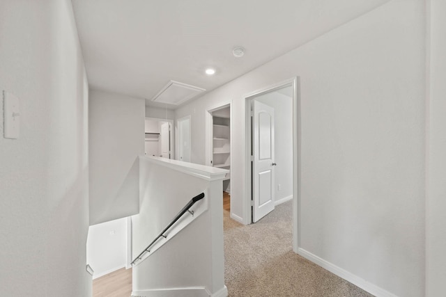 4702 Fillmore Dr, Greenville, TX 75401 - corridor featuring attic access, an upstairs landing, baseboards, and light colored carpet