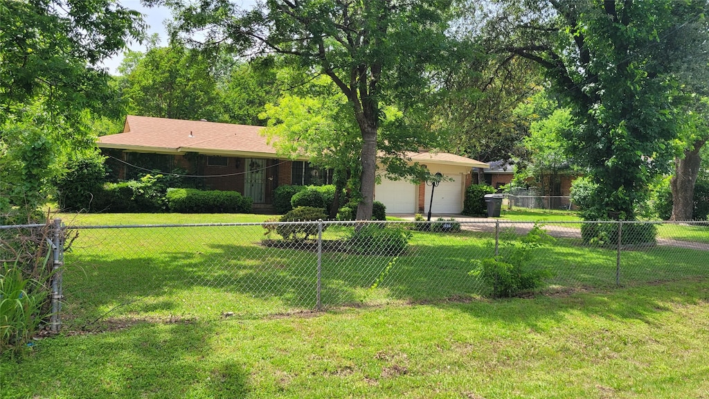 4627 Hedgdon Dr, Dallas, TX 75216 - back of property featuring a garage and concrete driveway