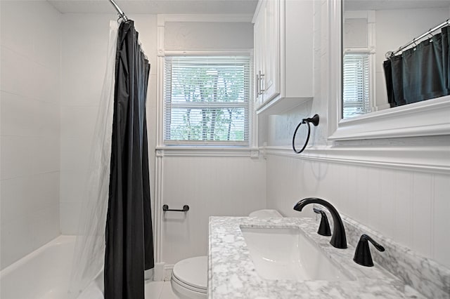315 Westway Dr, Rockwall, TX 75087 - full bathroom featuring a sink, toilet, a wainscoted wall, and shower / bathtub combination with curtain