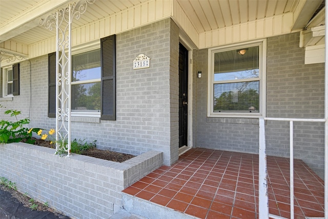 315 Westway Dr, Rockwall, TX 75087 - doorway to property with brick siding and a porch