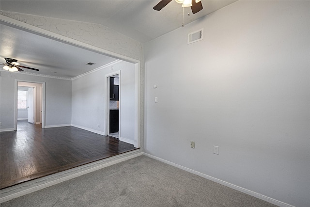 315 Westway Dr, Rockwall, TX 75087 - empty room with ceiling fan, baseboards, vaulted ceiling, ornamental molding, and dark wood-style floors