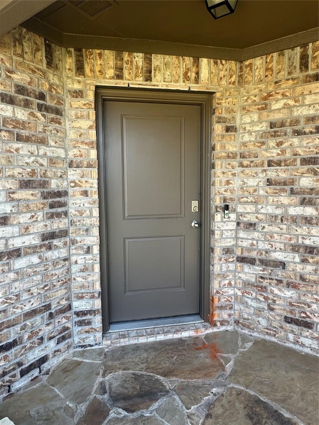 2419 Karnack Dr, Forney, TX 75126 - view of exterior entry featuring brick siding