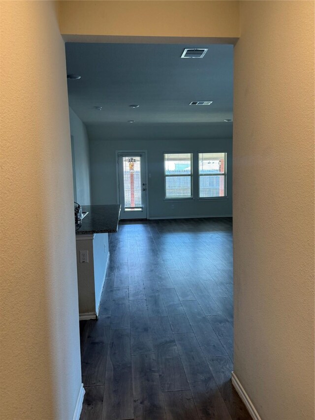 2419 Karnack Dr, Forney, TX 75126 - hallway featuring dark wood-style flooring and baseboards