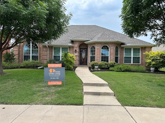 1409 Kingsley Dr, Allen, TX 75013 - view of front of house with brick siding, roof with shingles, and a front lawn