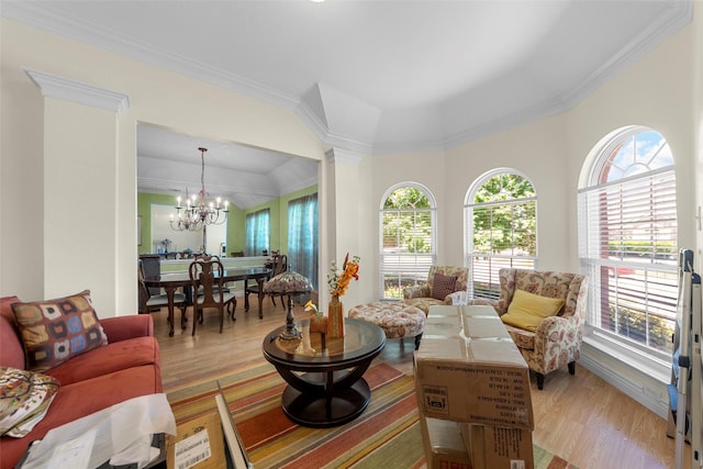 1409 Kingsley Dr, Allen, TX 75013 - living room with a chandelier, light wood-type flooring, plenty of natural light, and ornamental molding