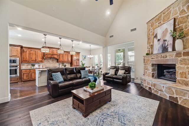 782 Sagewood Dr, Frisco, TX 75036 - living room featuring recessed lighting, dark wood finished floors, a stone fireplace, high vaulted ceiling, and a ceiling fan