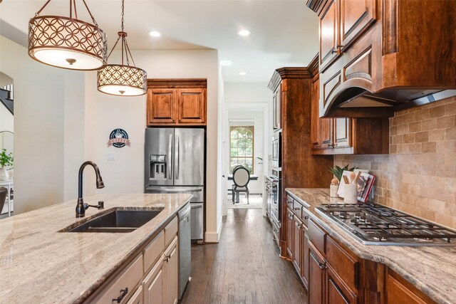 782 Sagewood Dr, Frisco, TX 75036 - kitchen with a sink, light stone countertops, dark wood-style floors, decorative backsplash, and stainless steel appliances