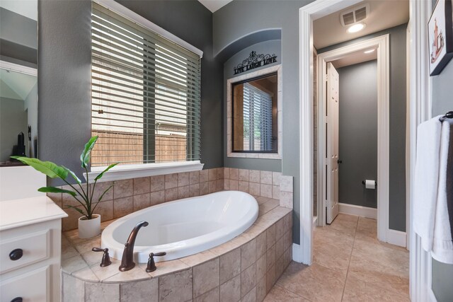 782 Sagewood Dr, Frisco, TX 75036 - bathroom with a garden tub, tile patterned floors, and vanity