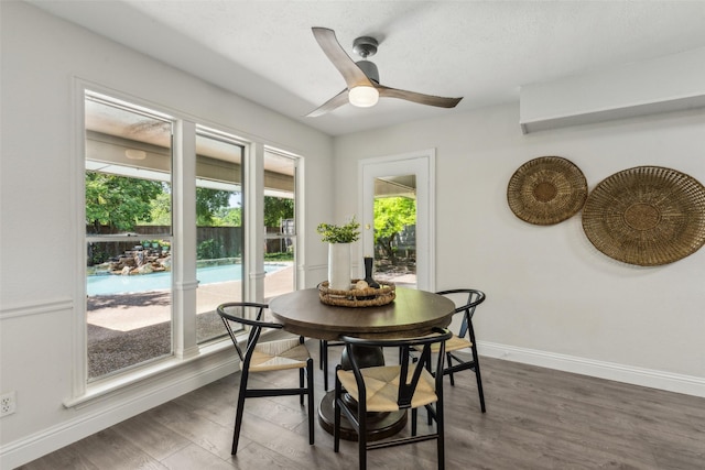6908 Heatherknoll Dr, Dallas, TX 75248 - dining area with a ceiling fan, baseboards, dark wood-style flooring, and a textured ceiling
