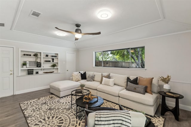 6908 Heatherknoll Dr, Dallas, TX 75248 - living room featuring wood finished floors, built in shelves, and a ceiling fan