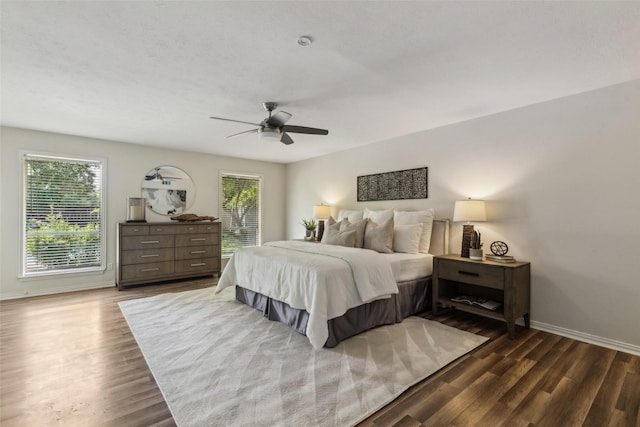 6908 Heatherknoll Dr, Dallas, TX 75248 - bedroom featuring baseboards, dark wood finished floors, and a ceiling fan