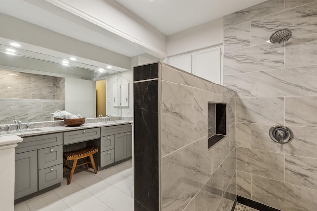 6908 Heatherknoll Dr, Dallas, TX 75248 - bathroom with double vanity, a tile shower, tile patterned flooring, and recessed lighting