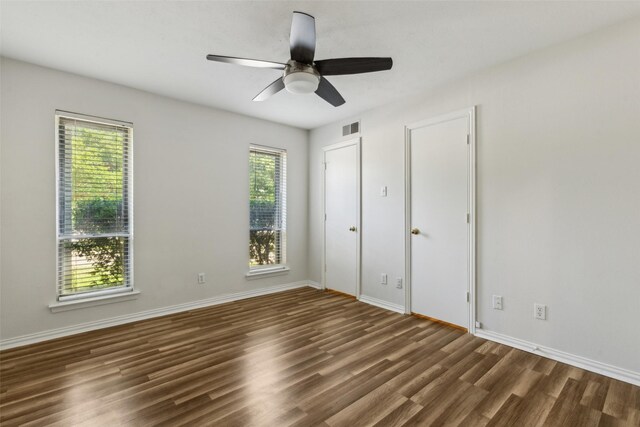 6908 Heatherknoll Dr, Dallas, TX 75248 - unfurnished bedroom with wood finished floors, baseboards, and a ceiling fan