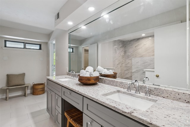 6908 Heatherknoll Dr, Dallas, TX 75248 - full bath featuring double vanity, recessed lighting, and a tile shower