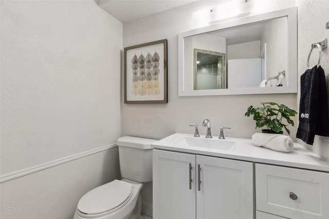 6908 Heatherknoll Dr, Dallas, TX 75248 - bathroom with toilet, vanity, and a textured wall