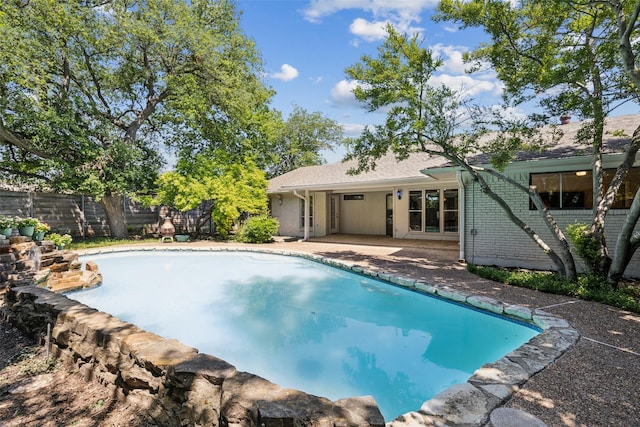 6908 Heatherknoll Dr, Dallas, TX 75248 - view of swimming pool featuring fence and a patio