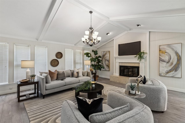 6908 Heatherknoll Dr, Dallas, TX 75248 - living room with wood finished floors, a chandelier, a fireplace, and baseboards