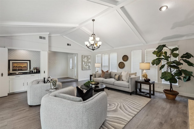 6908 Heatherknoll Dr, Dallas, TX 75248 - living area with wood finished floors, a chandelier, and baseboards