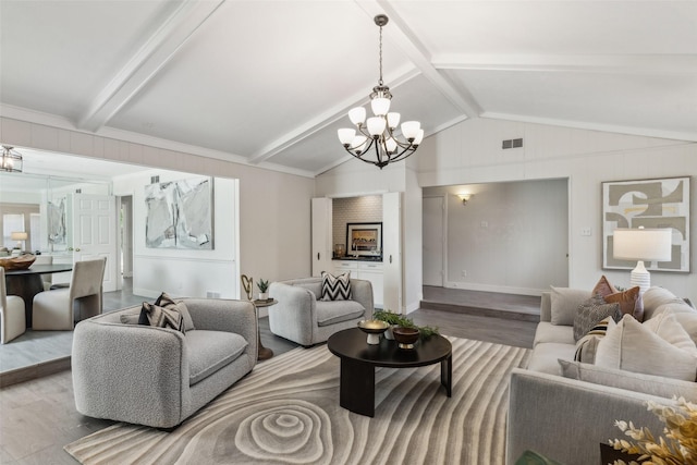 6908 Heatherknoll Dr, Dallas, TX 75248 - living area with wood finished floors and a chandelier