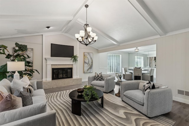 6908 Heatherknoll Dr, Dallas, TX 75248 - living room with wood finished floors, a chandelier, and a premium fireplace