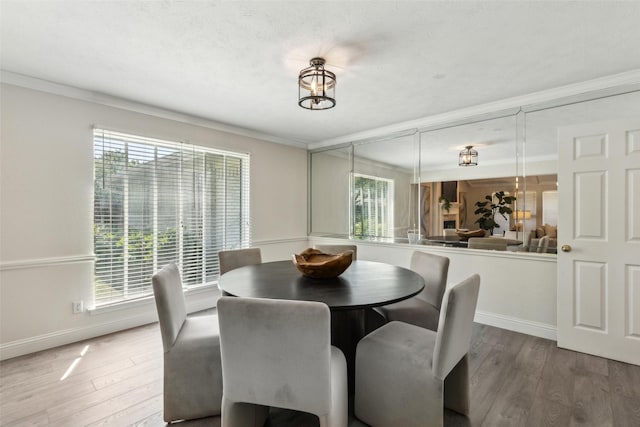 6908 Heatherknoll Dr, Dallas, TX 75248 - dining space with ornamental molding, wood finished floors, and baseboards