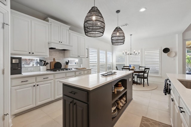 2512 Green Meadow Dr, Sachse, TX 75048 - kitchen featuring a chandelier, decorative backsplash, light countertops, plenty of natural light, and recessed lighting