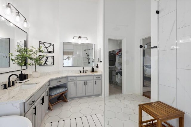 2512 Green Meadow Dr, Sachse, TX 75048 - full bath with a towering ceiling, double vanity, a spacious closet, and tile patterned floors