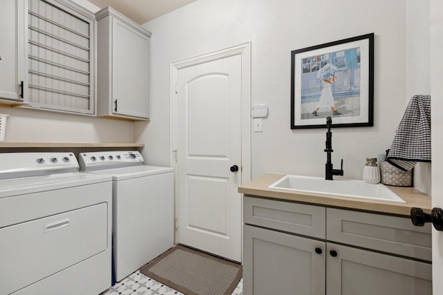 2512 Green Meadow Dr, Sachse, TX 75048 - washroom featuring cabinet space and washing machine and clothes dryer
