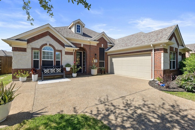 2512 Green Meadow Dr, Sachse, TX 75048 - view of front of home with a garage, brick siding, roof with shingles, and driveway