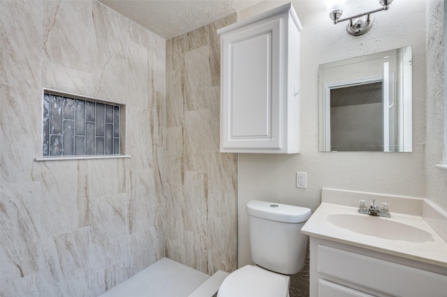 5217 Mack Rd, Haltom City, TX 76117 - bathroom with vanity, toilet, and tiled shower