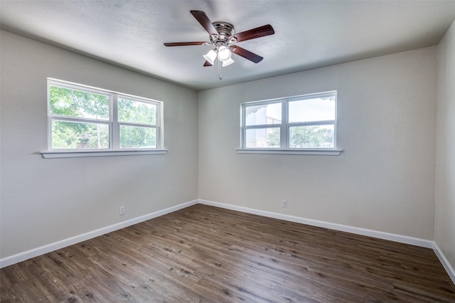 5217 Mack Rd, Haltom City, TX 76117 - empty room with plenty of natural light, baseboards, wood finished floors, and ceiling fan