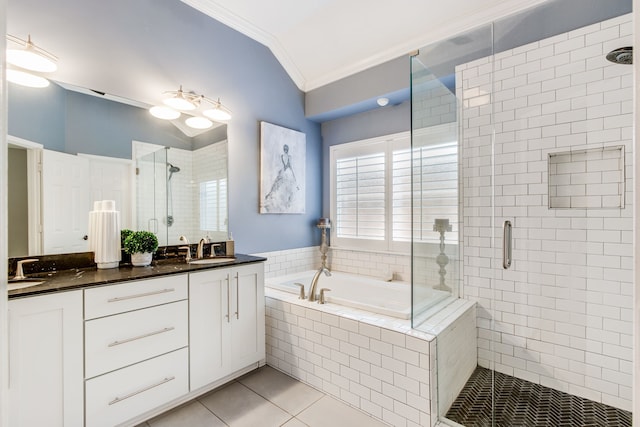 full bathroom featuring crown molding, a shower stall, a bath, tile patterned floors, and double vanity