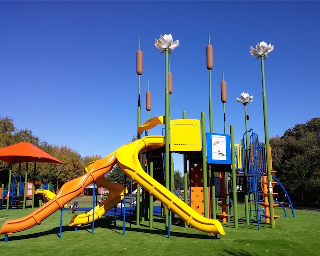 communal playground featuring a yard
