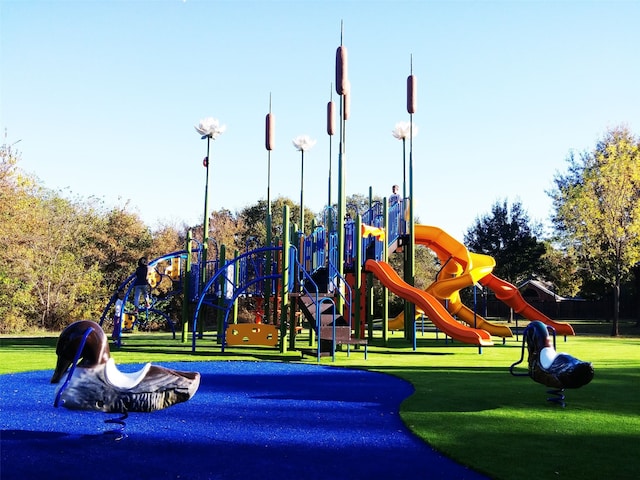 community jungle gym with a lawn
