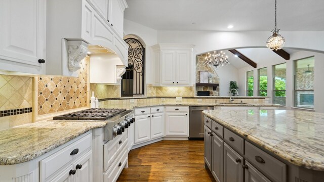 kitchen featuring appliances with stainless steel finishes, gray cabinetry, a sink, white cabinets, and recessed lighting