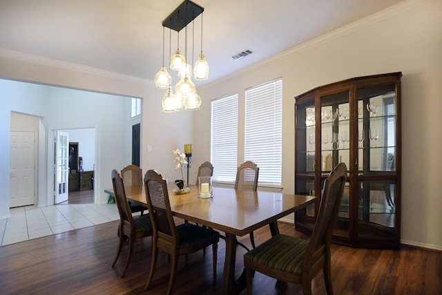 5315 Summit Knoll Trl, Sachse, TX 75048 - dining room with wood finished floors, ornamental molding, a chandelier, and baseboards