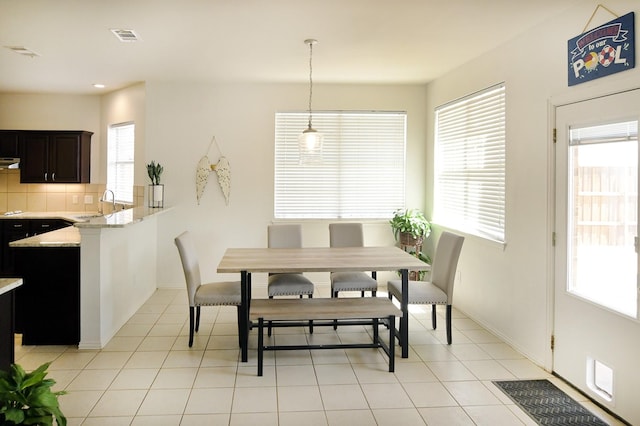 5315 Summit Knoll Trl, Sachse, TX 75048 - dining space with baseboards, light tile patterned floors, and recessed lighting