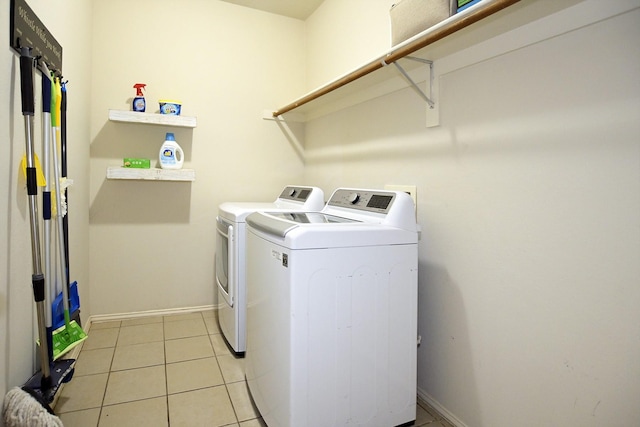 5315 Summit Knoll Trl, Sachse, TX 75048 - laundry area with washing machine and dryer, baseboards, and light tile patterned flooring