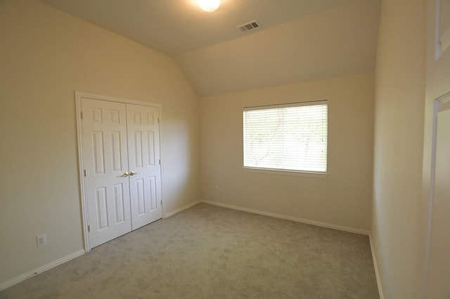 5315 Summit Knoll Trl, Sachse, TX 75048 - unfurnished bedroom featuring carpet floors, vaulted ceiling, baseboards, and a closet