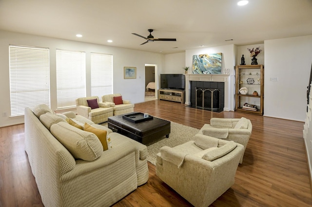 5315 Summit Knoll Trl, Sachse, TX 75048 - living room featuring ceiling fan, recessed lighting, healthy amount of natural light, a tiled fireplace, and wood finished floors
