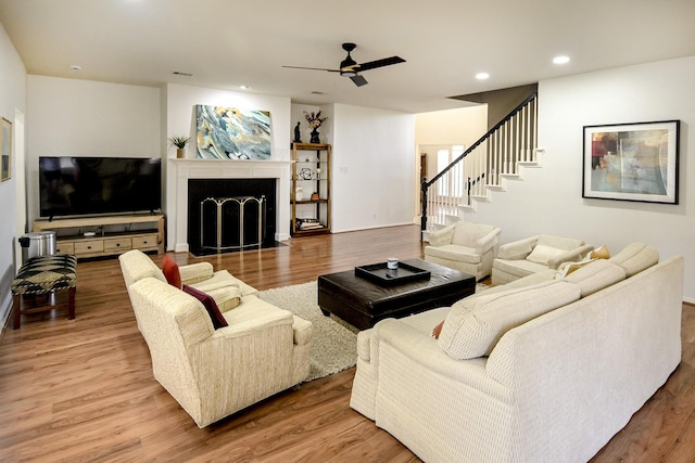 5315 Summit Knoll Trl, Sachse, TX 75048 - living room with a ceiling fan, wood finished floors, stairs, recessed lighting, and a fireplace with flush hearth