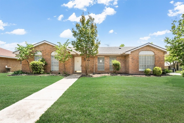 7102 Timberline Dr, Rowlett, TX 75089 - ranch-style house featuring brick siding and a front yard