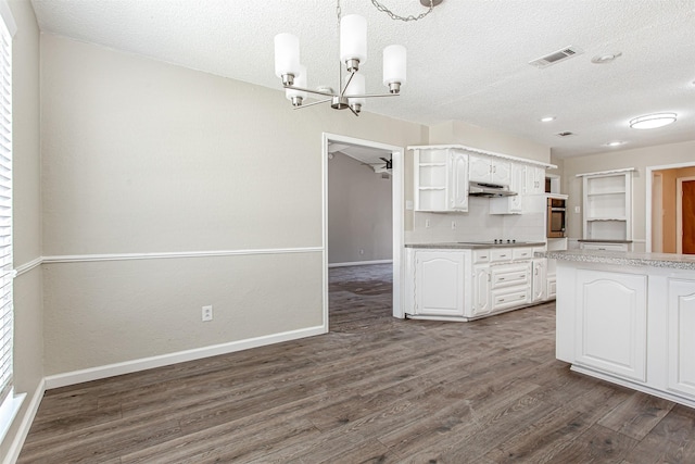 7102 Timberline Dr, Rowlett, TX 75089 - kitchen featuring open shelves, oven, a chandelier, white cabinets, and a textured ceiling