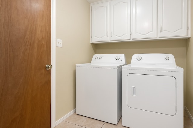 7102 Timberline Dr, Rowlett, TX 75089 - laundry area with washer and dryer, cabinet space, light tile patterned flooring, and baseboards