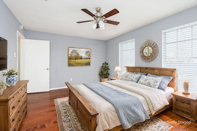 7102 Timberline Dr, Rowlett, TX 75089 - bedroom with wood finished floors, baseboards, and ceiling fan