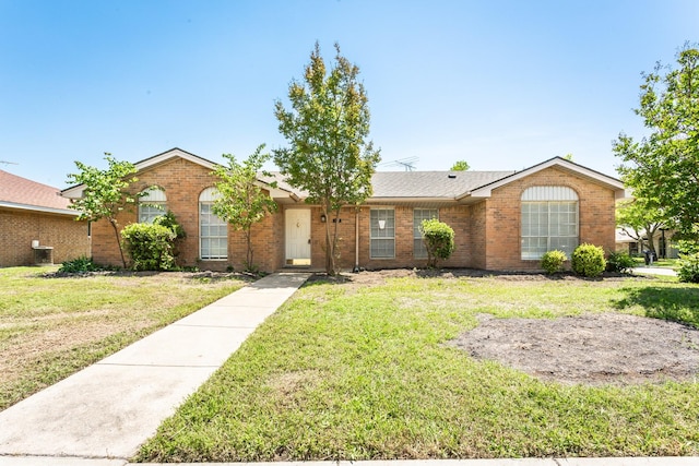 7102 Timberline Dr, Rowlett, TX 75089 - single story home featuring brick siding and a front lawn