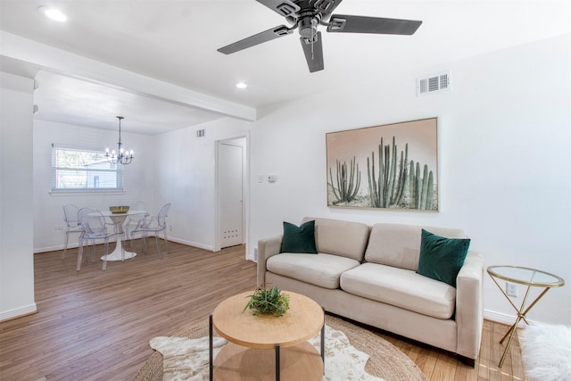 11521 Fernald Ave, Dallas, TX 75218 - living room featuring a chandelier, baseboards, a ceiling fan, light wood-style floors, and beam ceiling