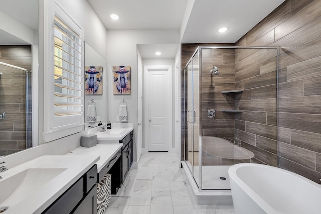 507 N Eagle Point Rd, Van Alstyne, TX 75495 - full bathroom featuring marble finish floors, a shower stall, double vanity, a freestanding tub, and recessed lighting