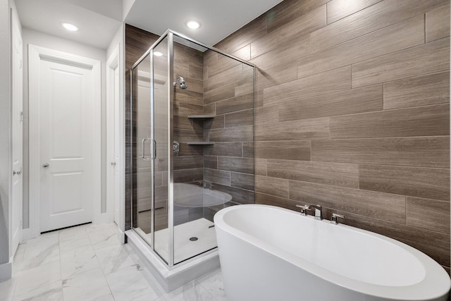 507 N Eagle Point Rd, Van Alstyne, TX 75495 - bathroom featuring a stall shower, a freestanding tub, recessed lighting, and marble finish flooring